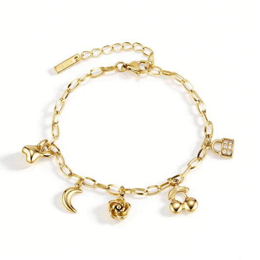 Gold bracelet featuring an elongated-link chain with crescent, rose, cherry and lock motifs, shown on a white background.