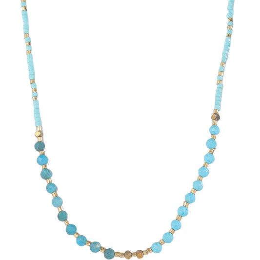 This delicate sky blue tourmaline and seed‑bead necklace delivers soft romantic‑feminine charm. 