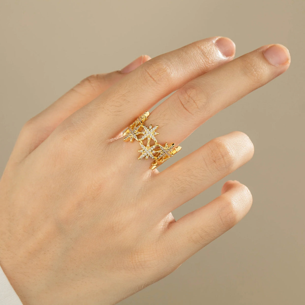 Gold-plated brass open ring shown on hand