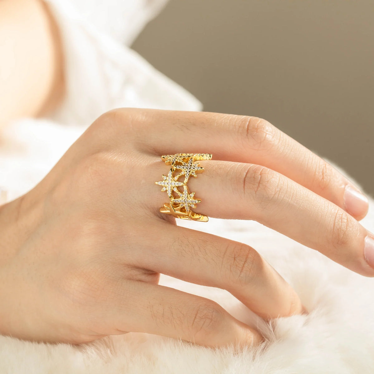 Gold-plated brass open ring shown on hand
