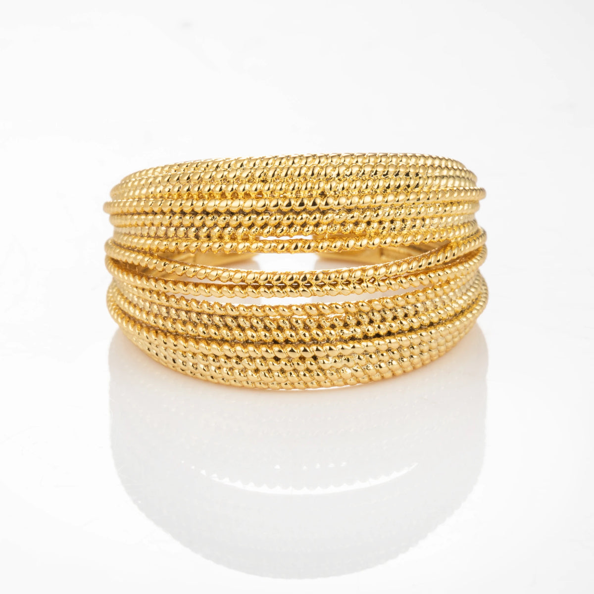 Rope Stack gold-plated brass open ring on white background