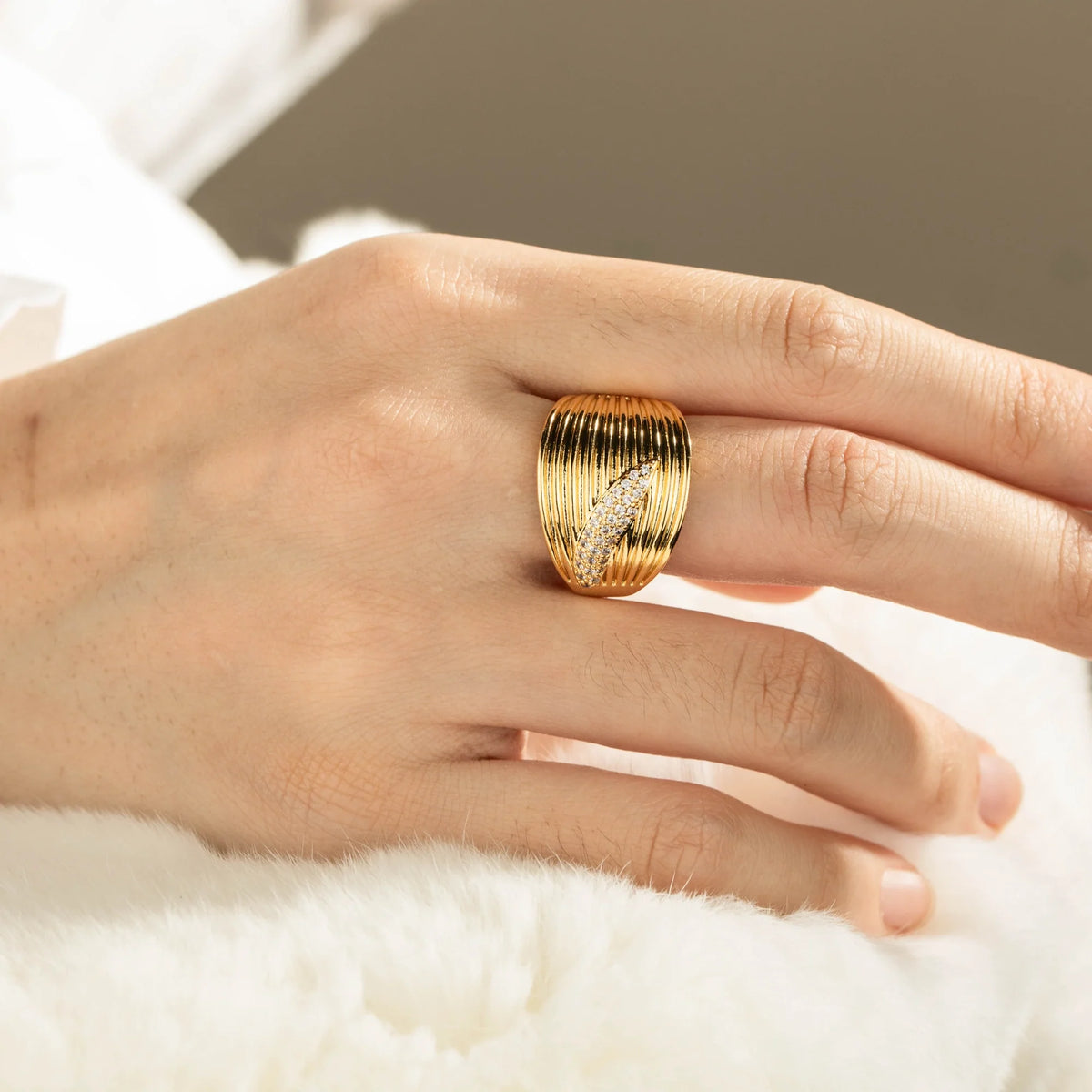 Gold-plated brass open ring shown on hand