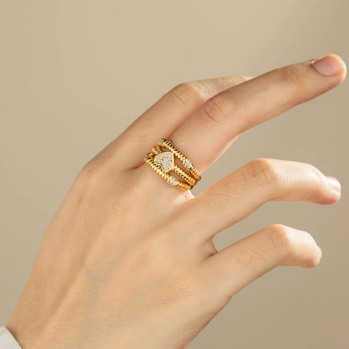 Gold-plated brass open ring shown on hand