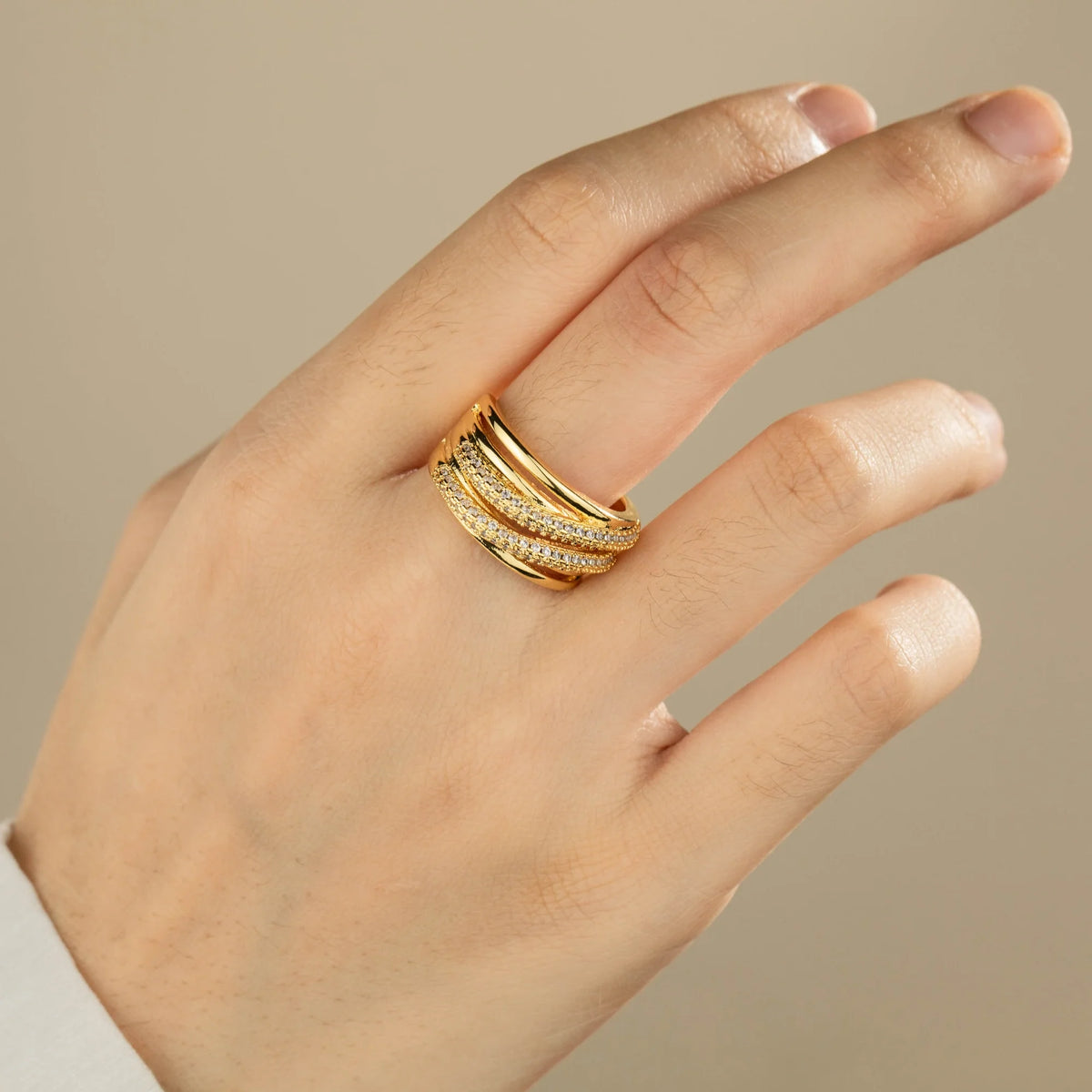 Gold-plated brass open ring shown on hand