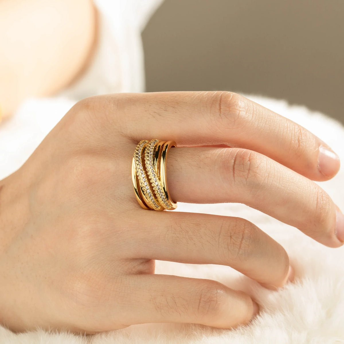 Gold-plated brass open ring shown on hand