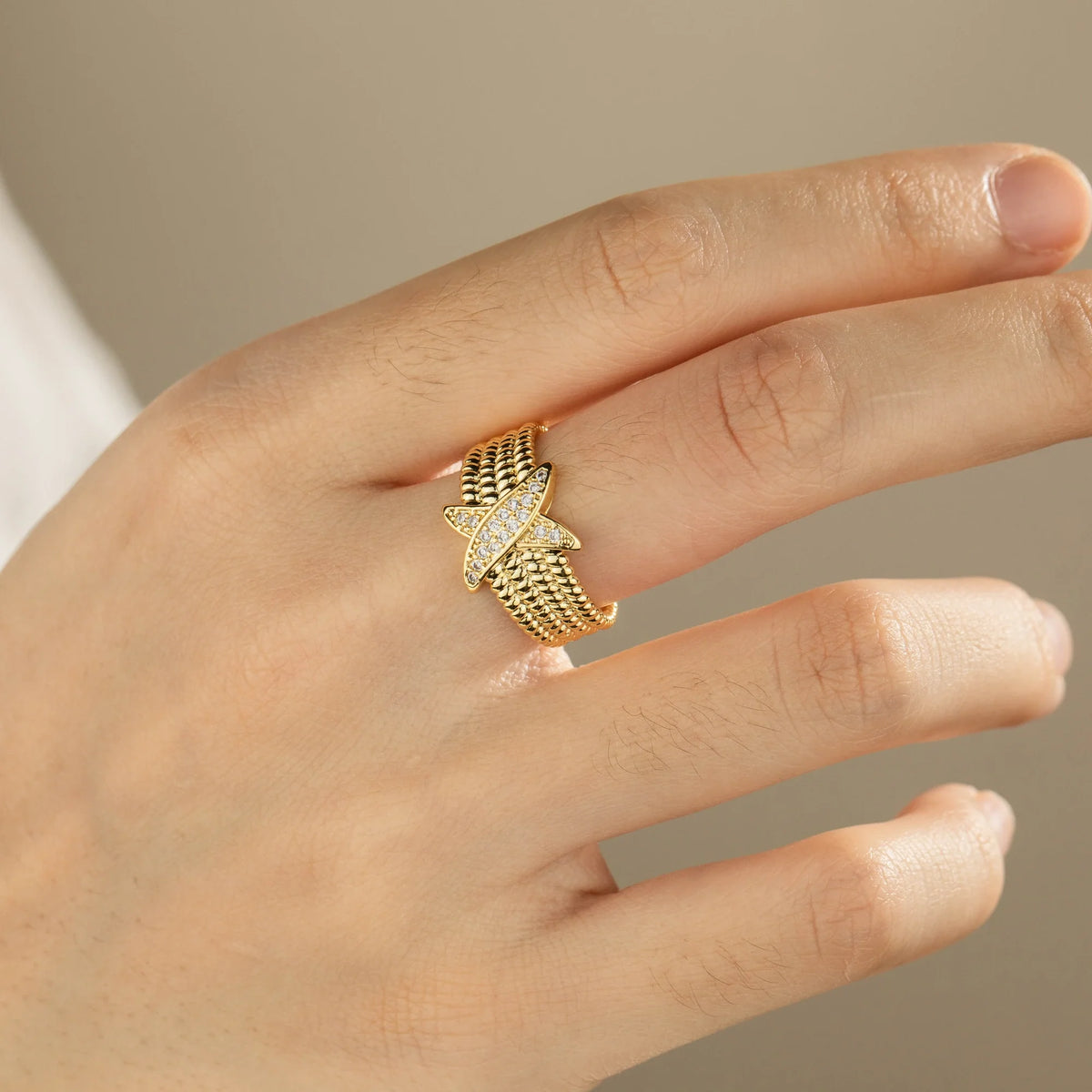 Gold-plated brass open ring shown on hand
