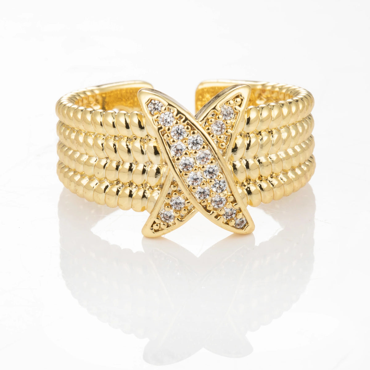 Crystal X gold-plated brass open ring on white background