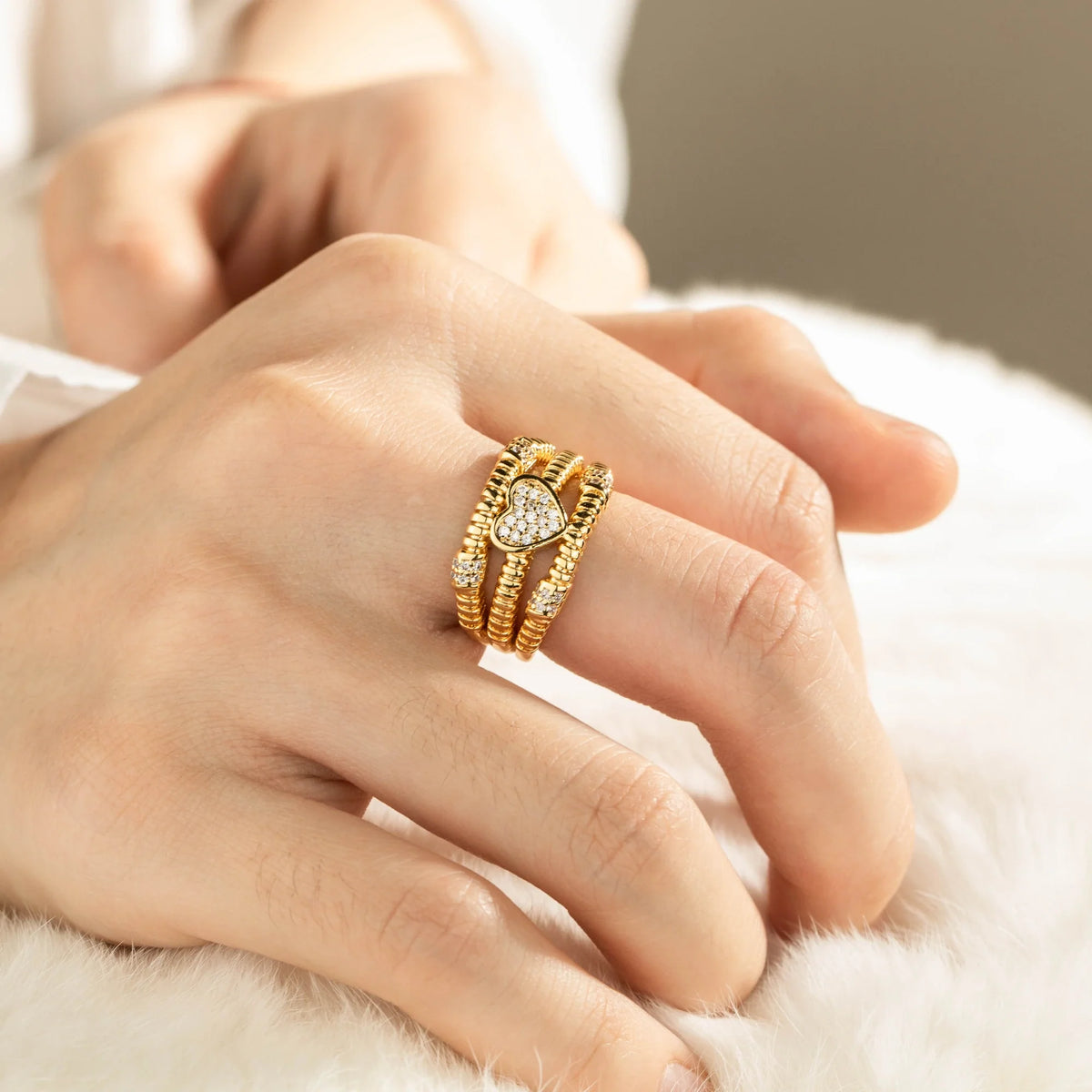 Gold-plated brass open ring shown on hand
