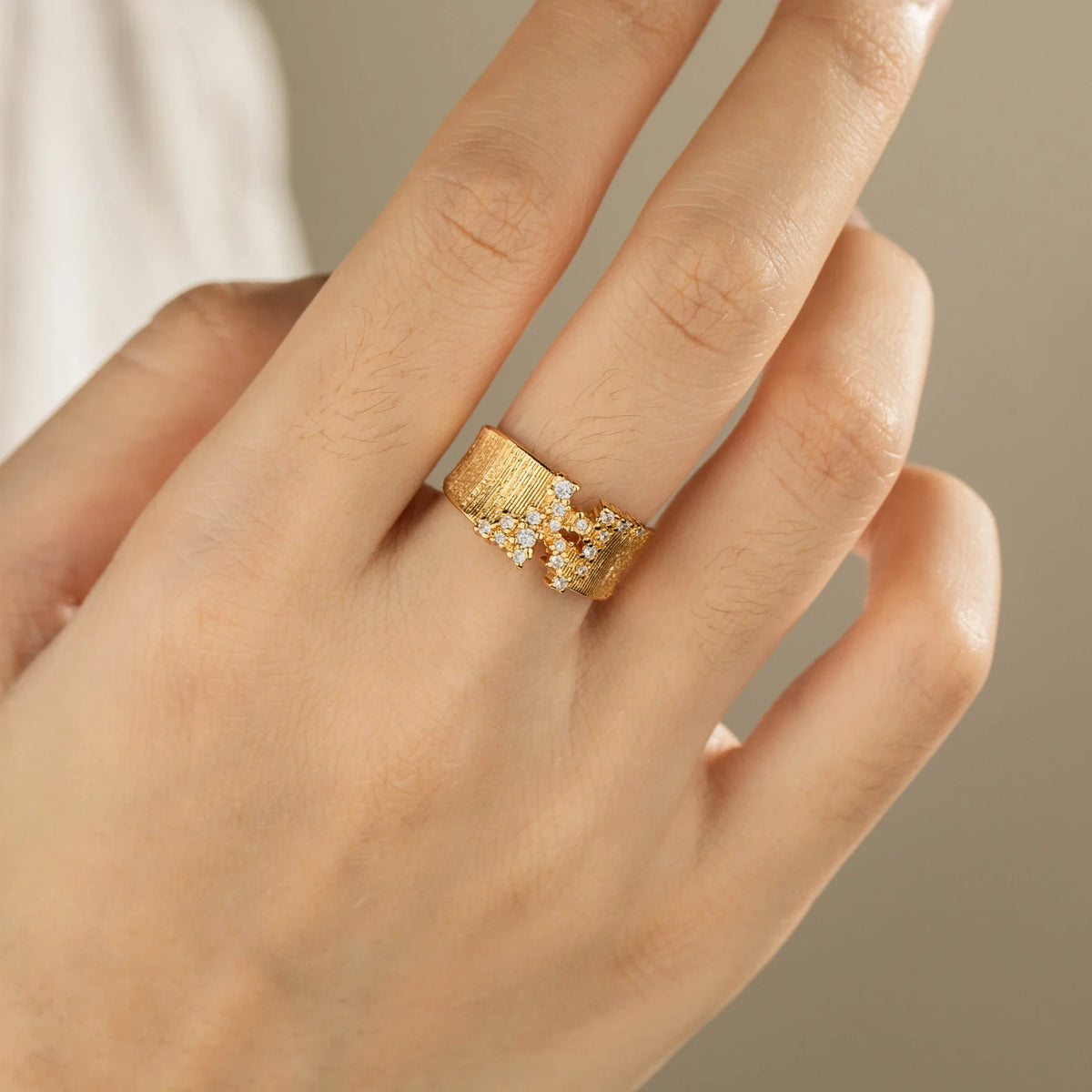 Gold-plated brass open ring shown on hand