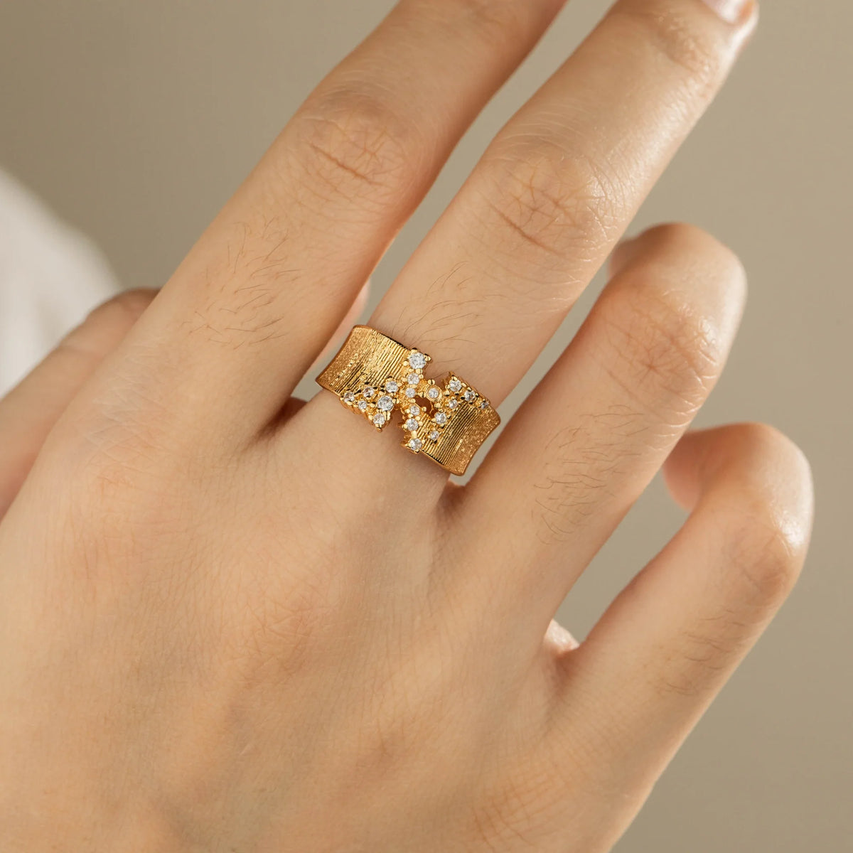 Gold-plated brass open ring shown on hand