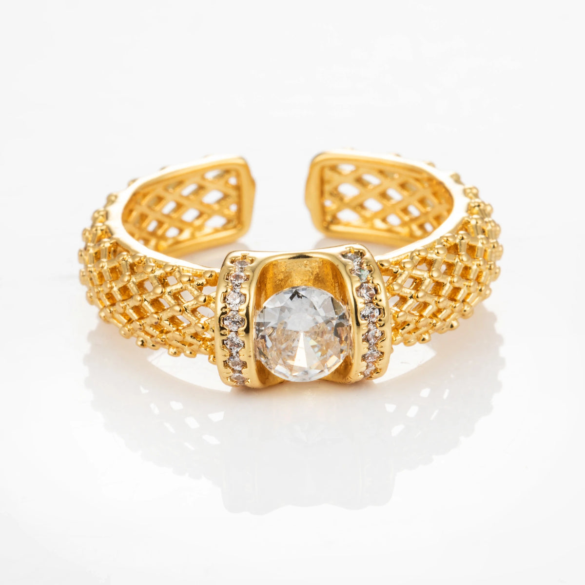 Cushion Weave gold-plated brass open ring on white background