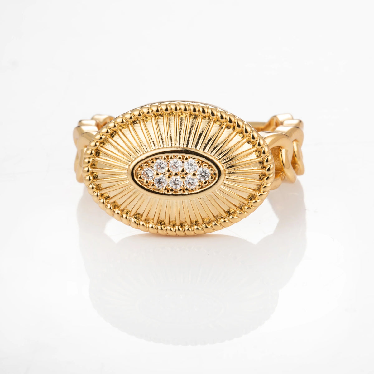 Oval Medallion gold-plated brass open ring on white background