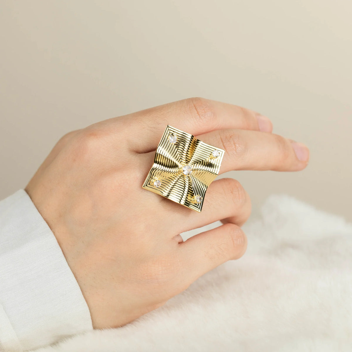 Gold-plated brass open ring shown on hand
