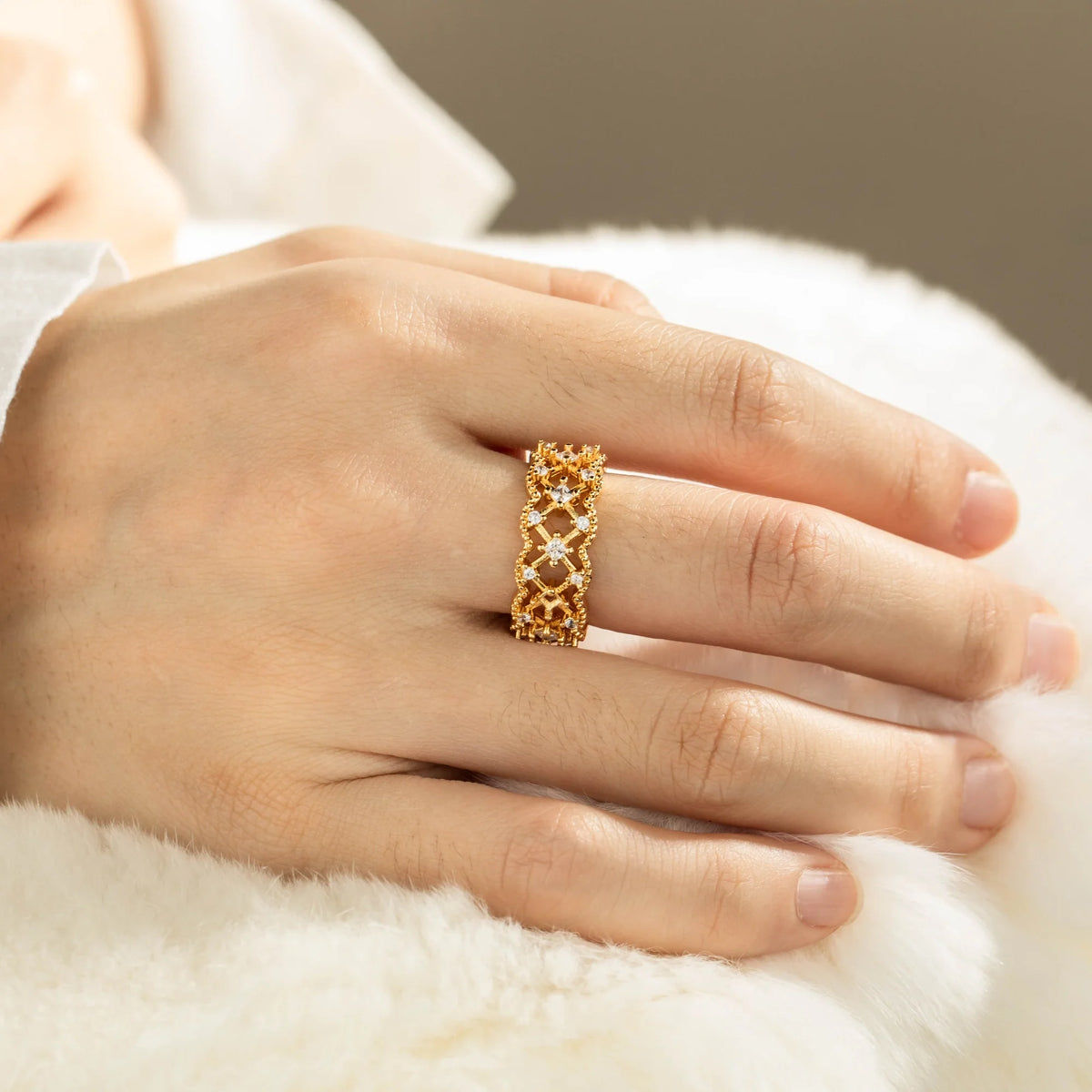 Gold-plated brass open ring shown on hand