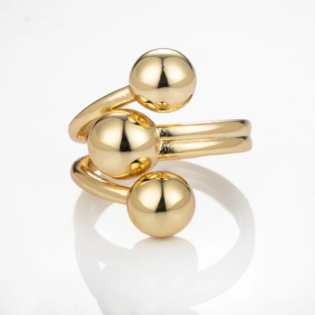 Triple Sphere gold-plated brass open ring on white background