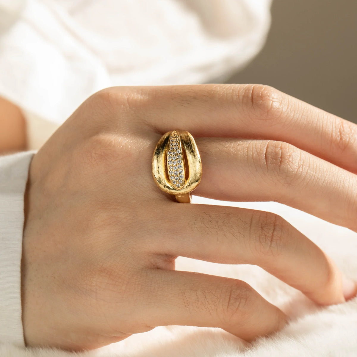 Gold-plated brass open ring shown on hand