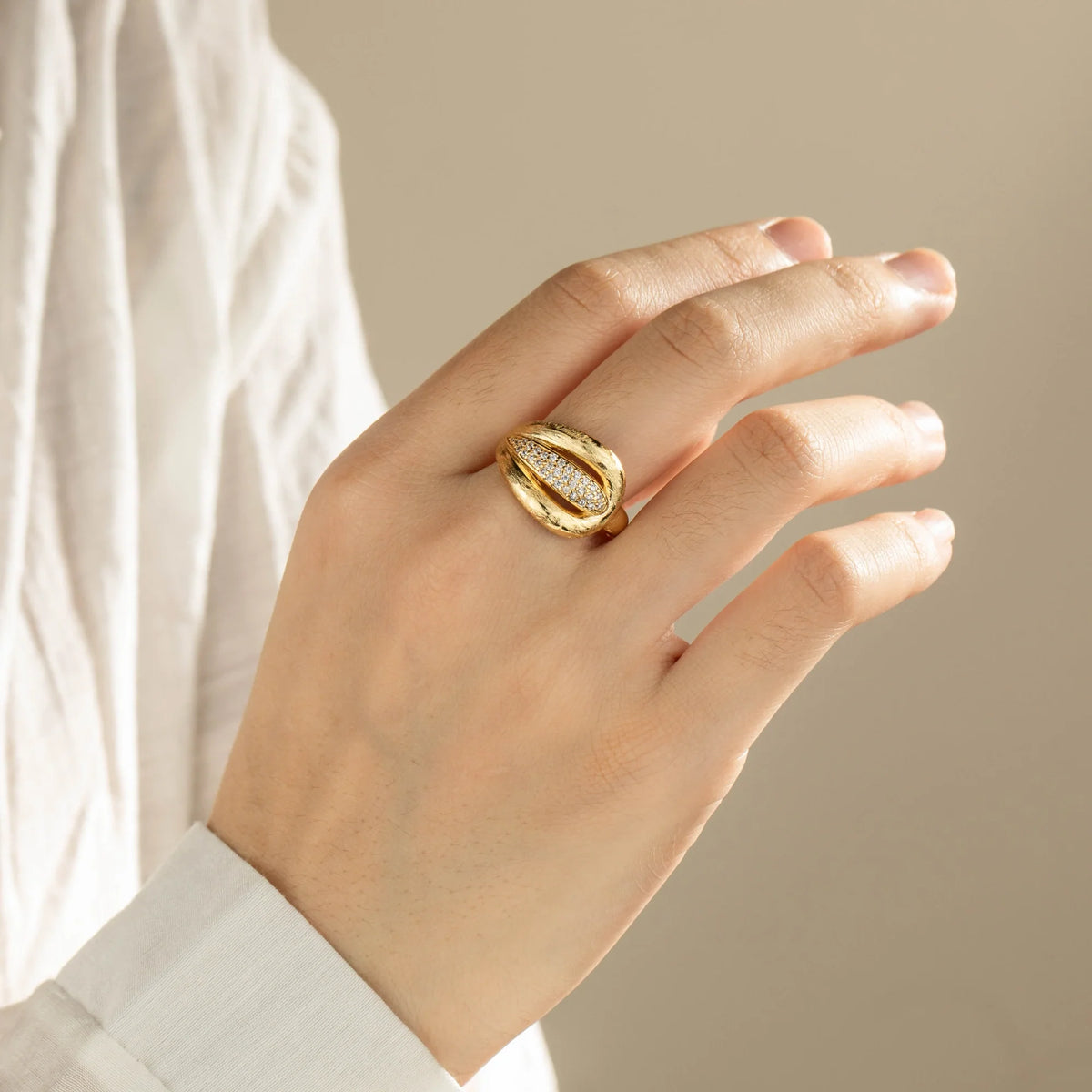 Gold-plated brass open ring shown on hand