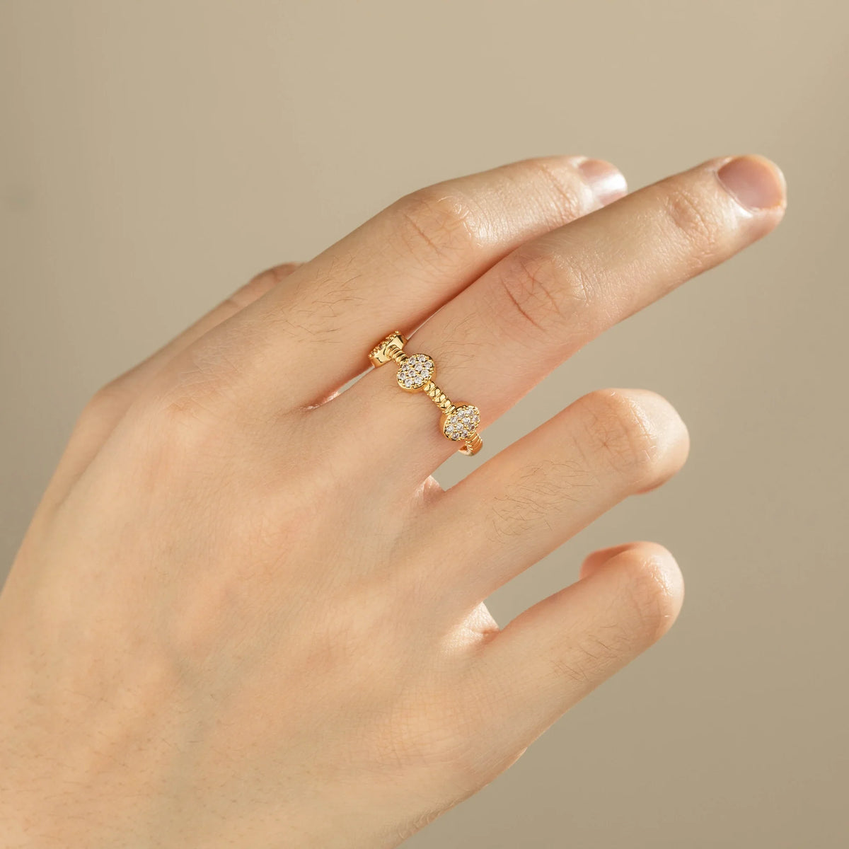 Gold-plated brass open ring shown on hand