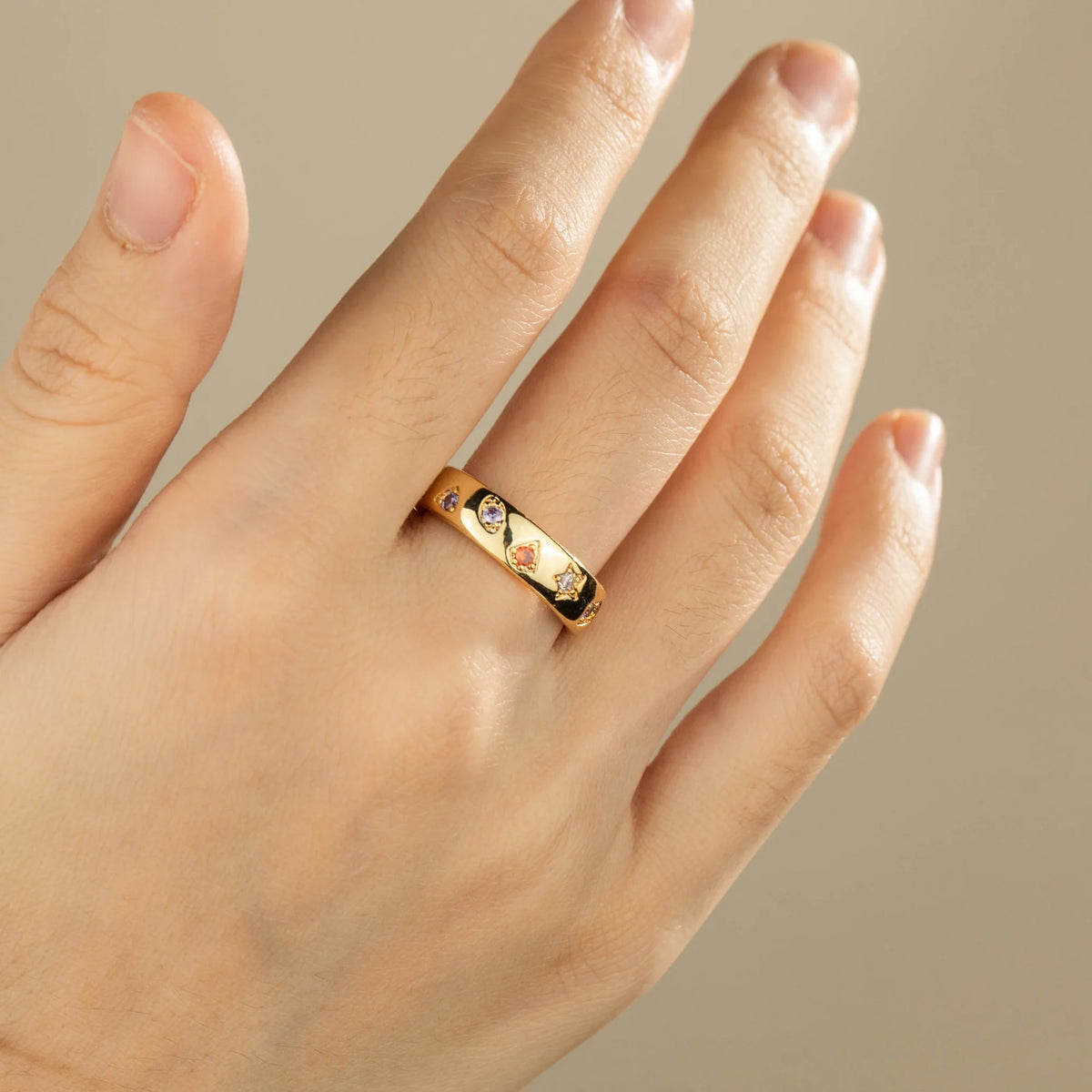 Gold-plated brass open ring shown on hand