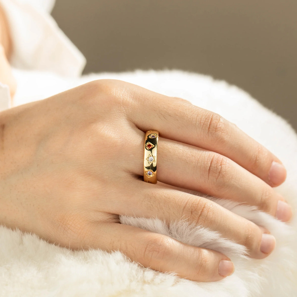Gold-plated brass open ring shown on hand