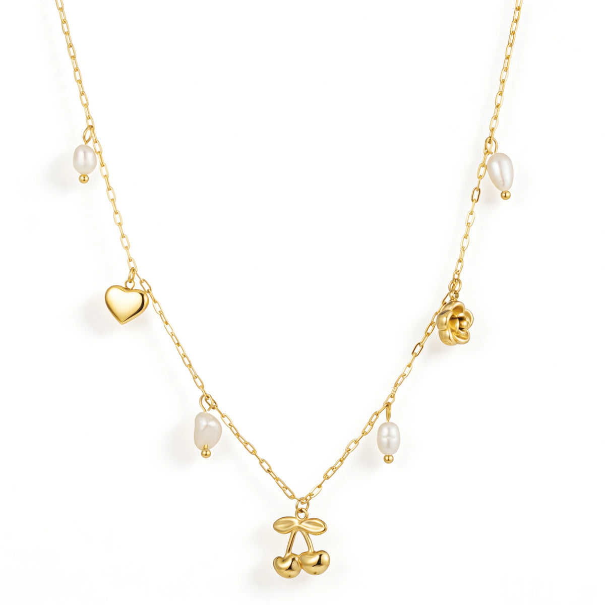 Gold necklace featuring a cherry centerpiece with heart, rose and white drop details, shown on a white background.