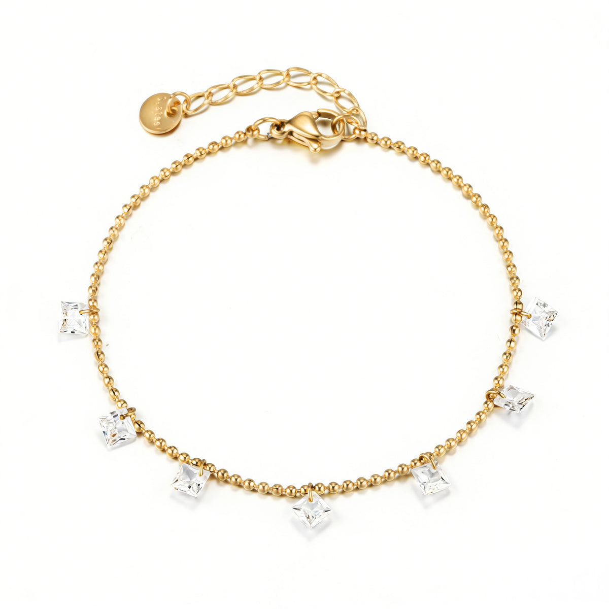 Gold bracelet featuring a row of dangling clear accents on a gold-tone chain, shown on a white background.