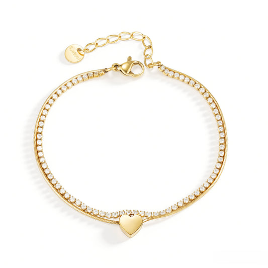 Gold bracelet featuring two contrasting rows and a polished heart centerpiece, shown on a white background.