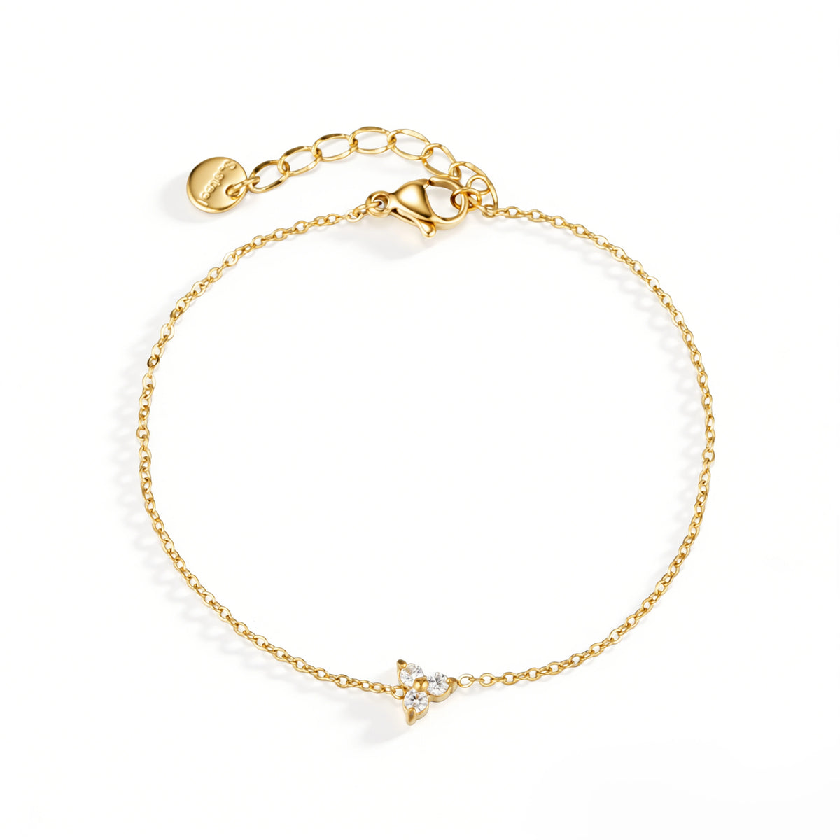 Gold bracelet featuring a fine chain with a petite clear butterfly-shaped accent, shown on a white background.