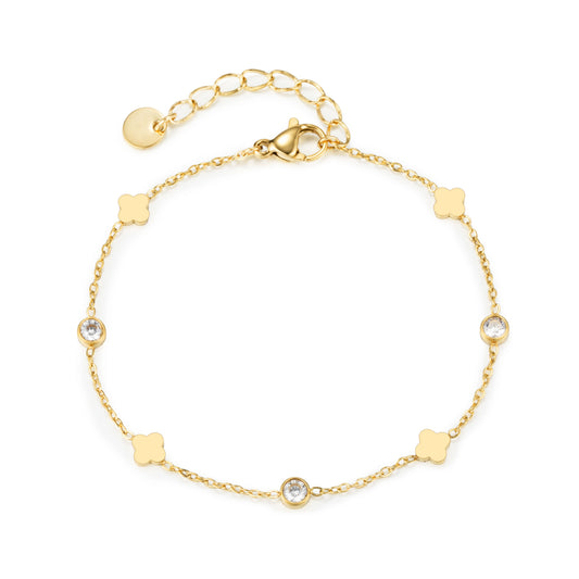 Gold bracelet featuring flat quatrefoil motifs alternating with clear round accents, shown on a white background.