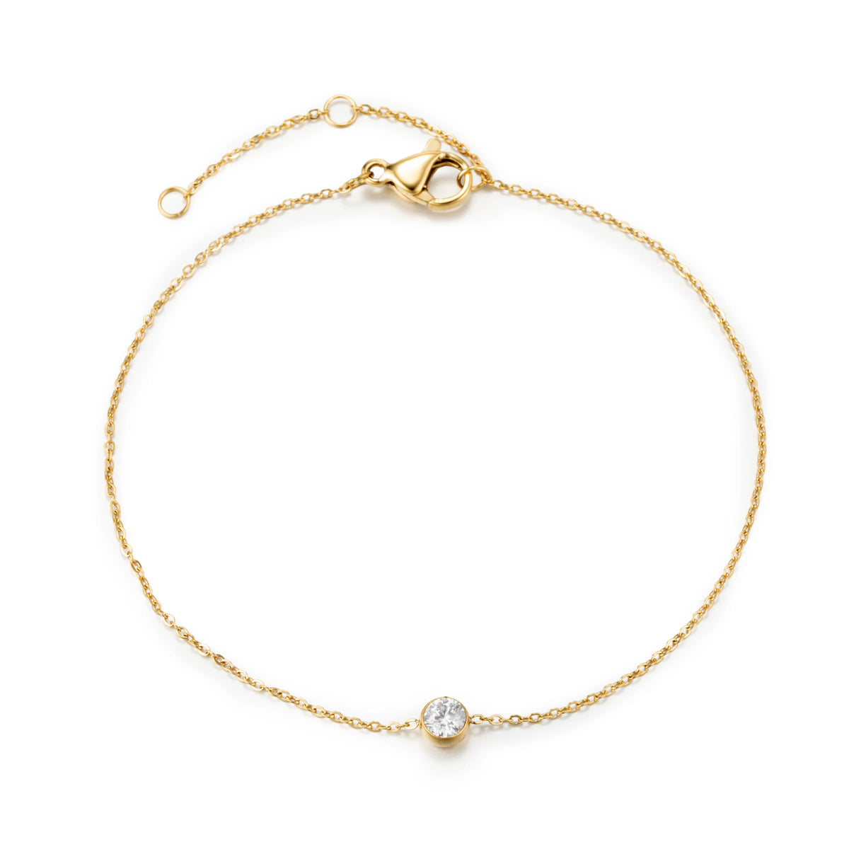 Gold bracelet featuring a fine gold-tone chain and a single clear round accent, shown on a white background.